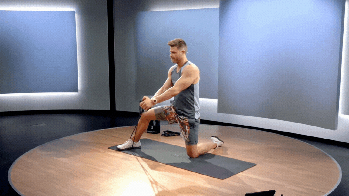 Peloton instructor Andy Speer demonstrates a resistance band woodchop.