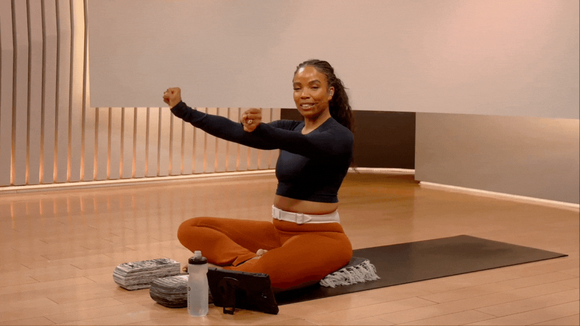 Peloton instructor Chelsea Jackson Roberts demonstrates wrist circles