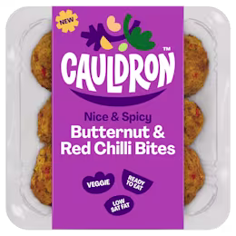 Cauldron Butternut & Red Chilli Bites in white packaging with a purple sleeve featuring the Cauldron logo and packaging weight. Six butternut squash bites can be seen behind the packaging sleeve.