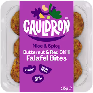 Cauldron Butternut & Red Chilli Bites in white packaging with a purple sleeve featuring the Cauldron logo and packaging weight. Six butternut squash bites can be seen behind the packaging sleeve.