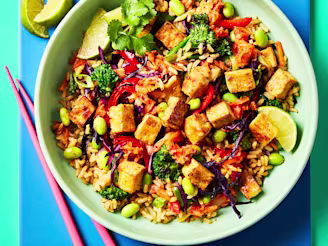 Colourful kimchi and tofu stir fry with vegetables, edamame beans, rice and Cauldron naked tofu pieces.