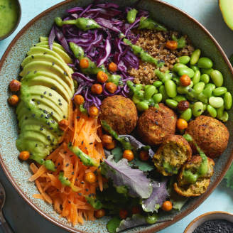 Falafel and quinoa Buddha bowl with peas in a bowl