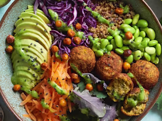 Falafel and quinoa Buddha bowl with peas in a bowl