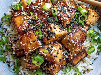 Sticky tofu rice bowl with crispy tofu in a bowl