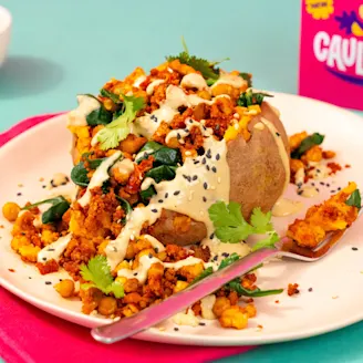 Jacket potato topped with a Cauldron Tofu mix 