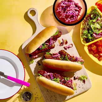 Cauldron Vegetarian Korean Hot Dogs on a wooden serving board ready to enjoy.