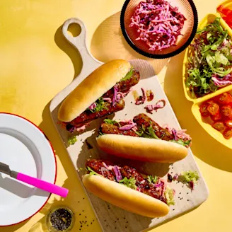 Cauldron Vegetarian Korean Hot Dogs on a wooden serving board ready to enjoy.