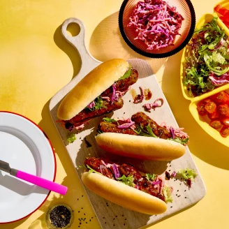 Cauldron Vegetarian Korean Hot Dogs on a wooden serving board ready to enjoy.