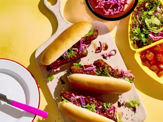 Cauldron Vegetarian Korean Hot Dogs on a wooden serving board ready to enjoy.