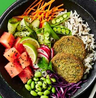 Cauldron spinach veggie bakes in a vegetable bowl with rice on the side in a black dish