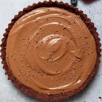 Chocolate Tofu no make mousse cake topped with chocolate flakes