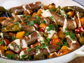 Spanish-inspired sausage traybake with Cauldron sausages topped served in a large white dish