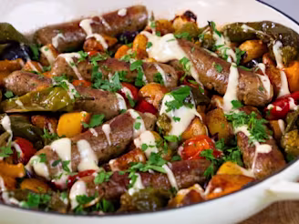 Spanish-inspired sausage traybake with Cauldron sausages topped served in a large white dish