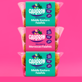 Three Cauldron ffalafel packs stacked on a pink background