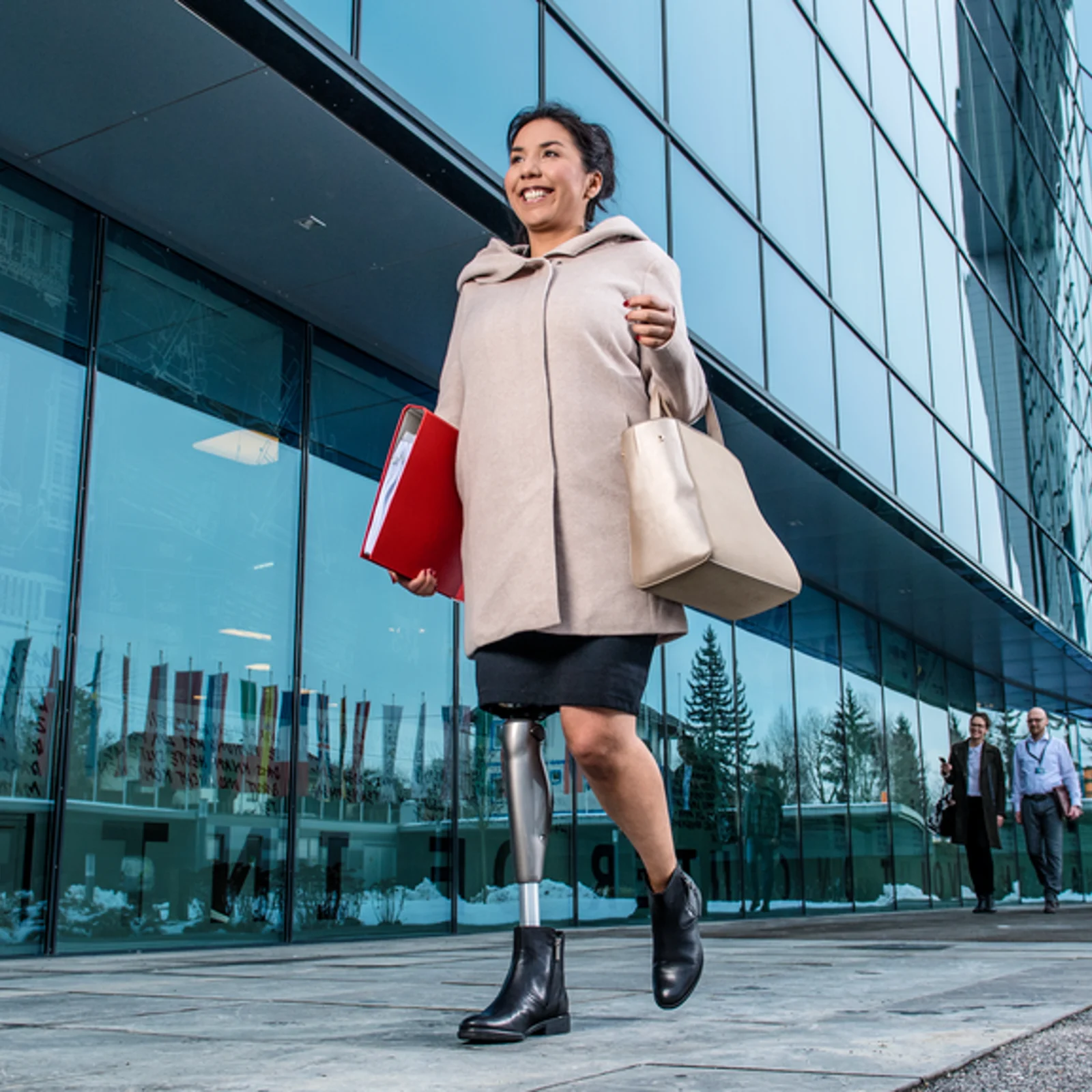 Woman with the C-leg prosthesis on her way to work.