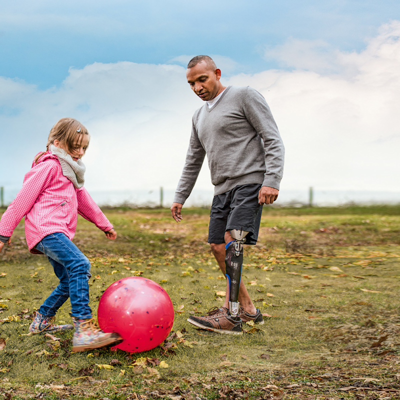 C-Brace user Melvin plays football with his daughter