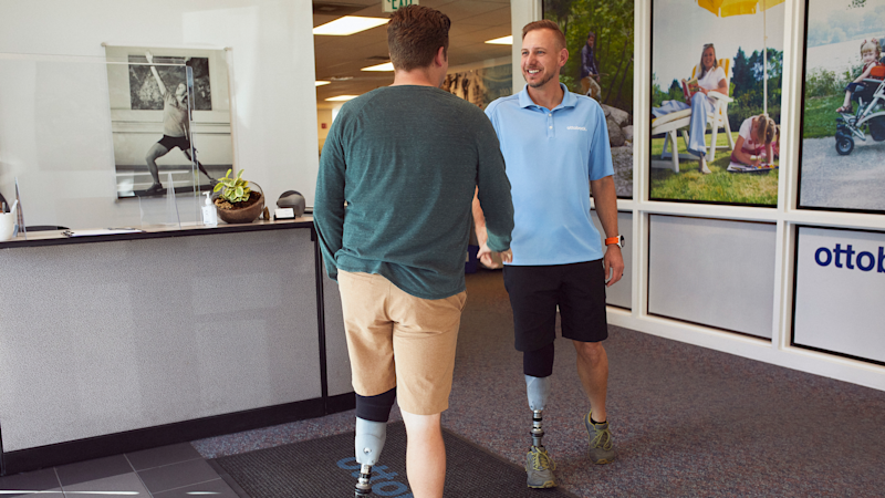 Jeffrey Waldmuller, a CPO, welcomes a leg prostethics user. Both wear the MyFit TT socket.