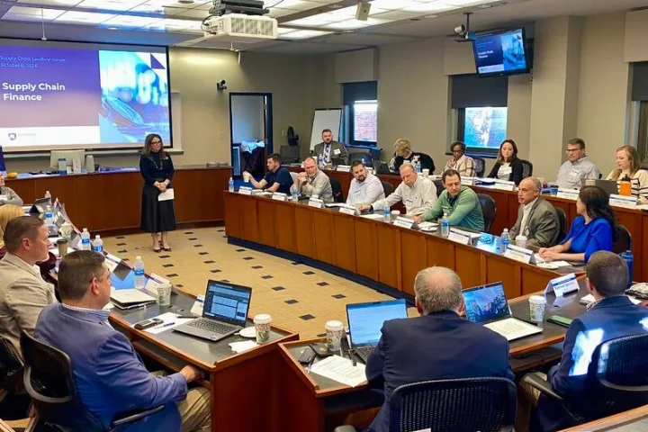 Supply Chain Leadership Forum attendees watch a presentation