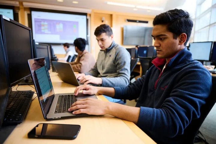 Student working on a computer in the Rogers Family Trading Room