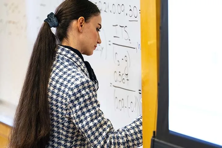 Delina Agnosteva in front of class