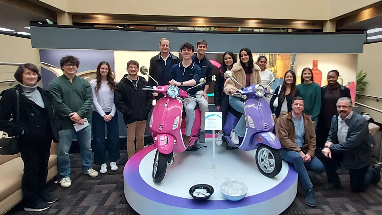Students posing on a factory tour