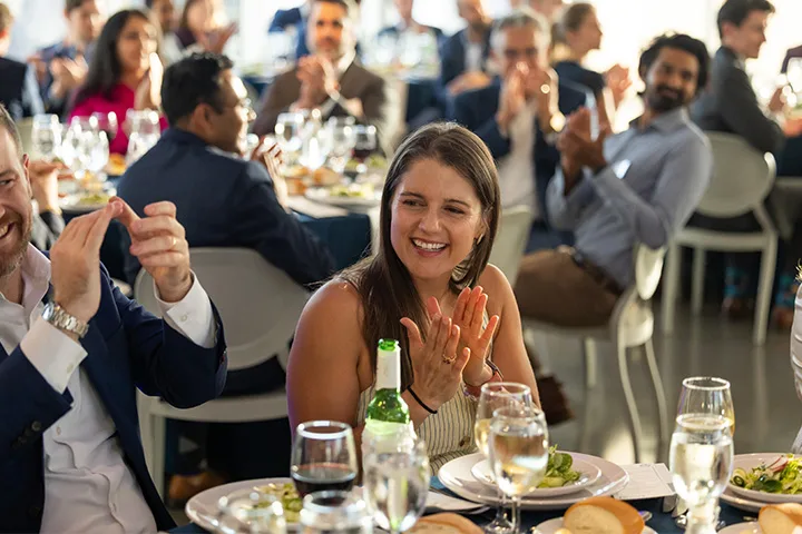 Picture of people clapping at event