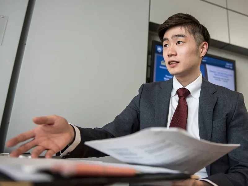 Student negotiating over papers