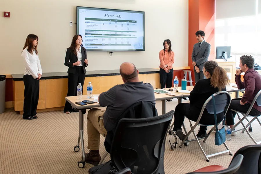 Students presenting to case competition committee