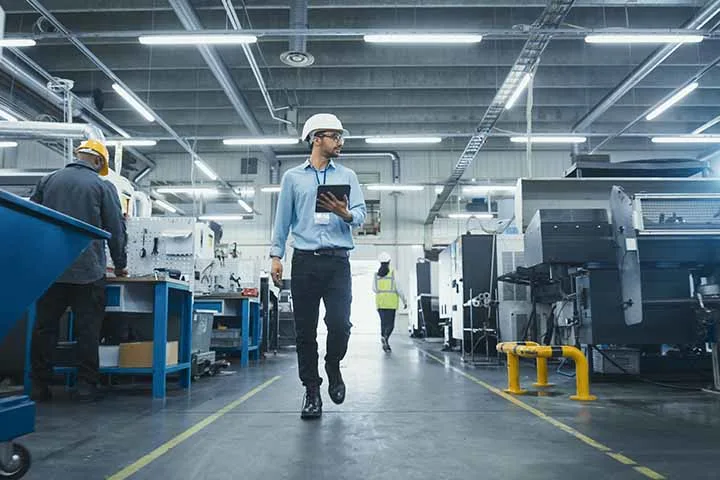 Man walking through factory
