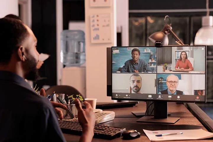 Man in front of teleconference