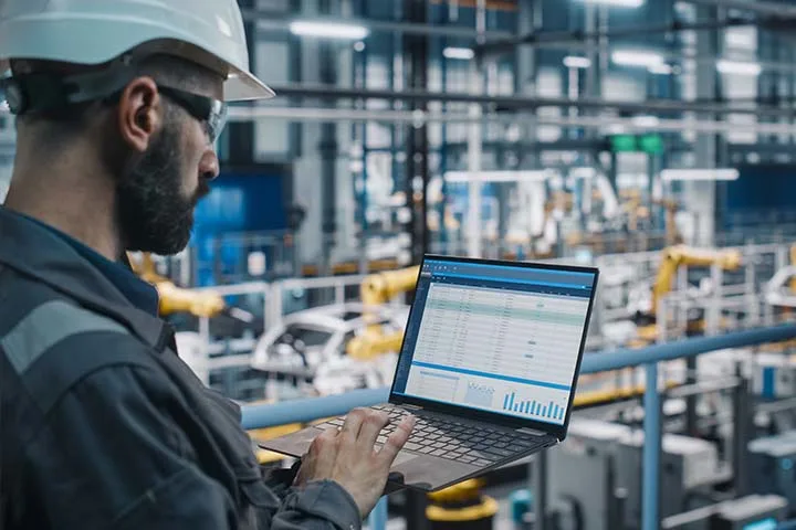 Man looking through supply chain analytics