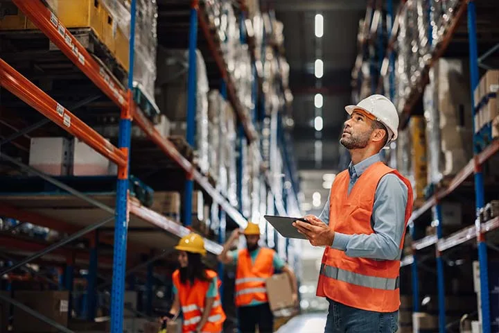 Man looking at warehouse shelves