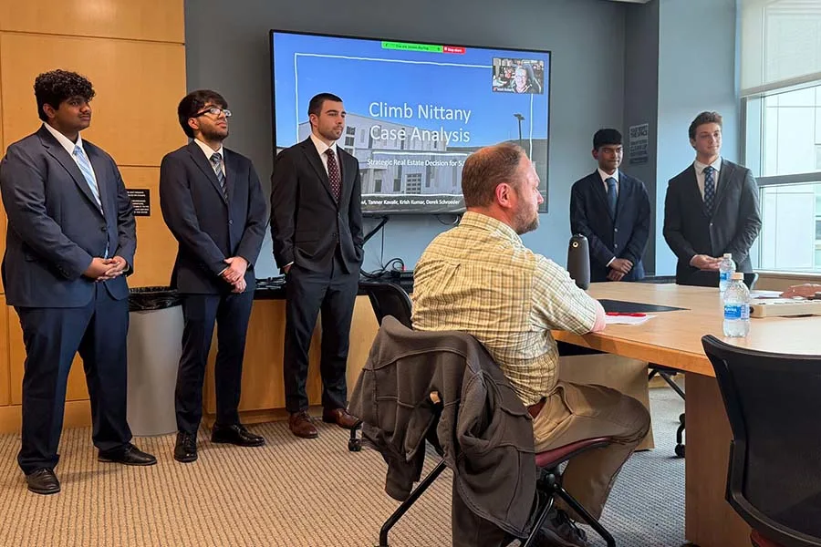 Students presenting to company
