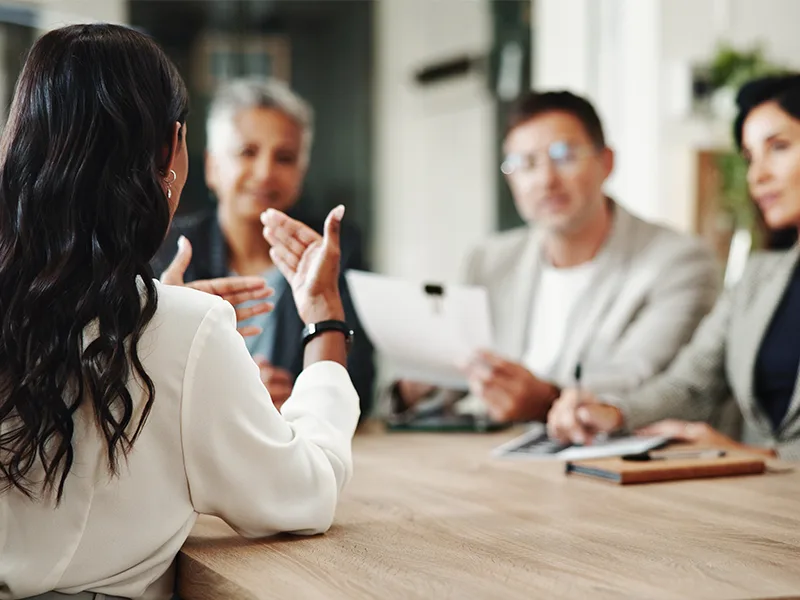 Woman speaking in business meeting