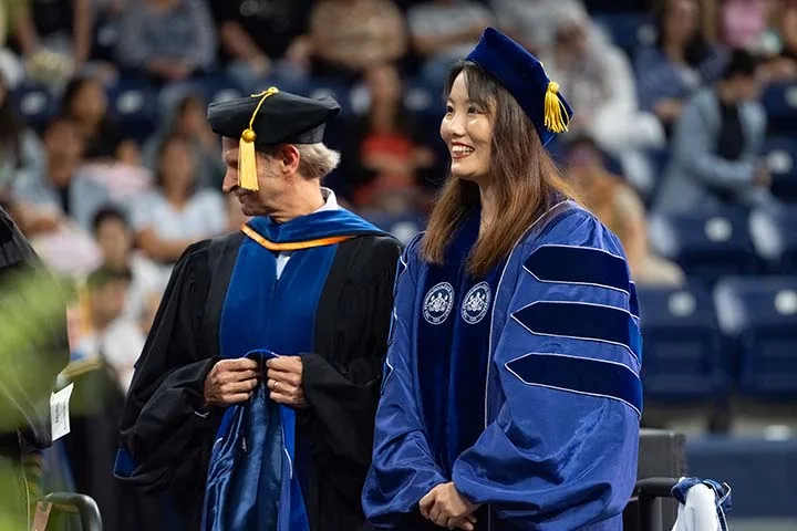 Woman smiling at commencement