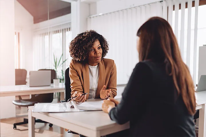 Woman working with another woman