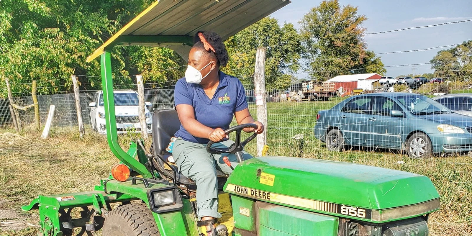 Photo of a woman operating a tractor