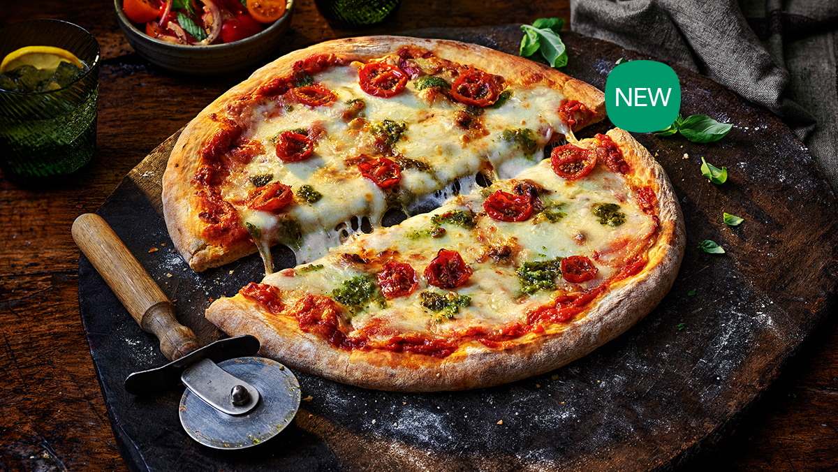 Large pizza and a pizza cutter.