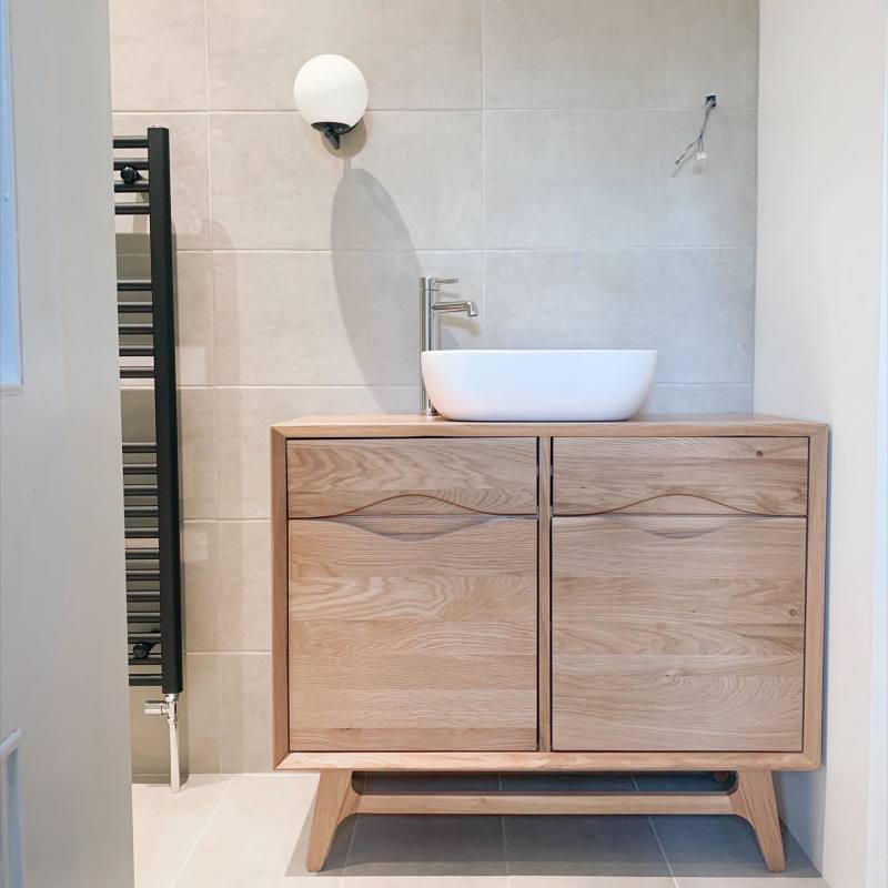 Small natural oak Scandi sideboard used as a sink and cupboard in the bathroom