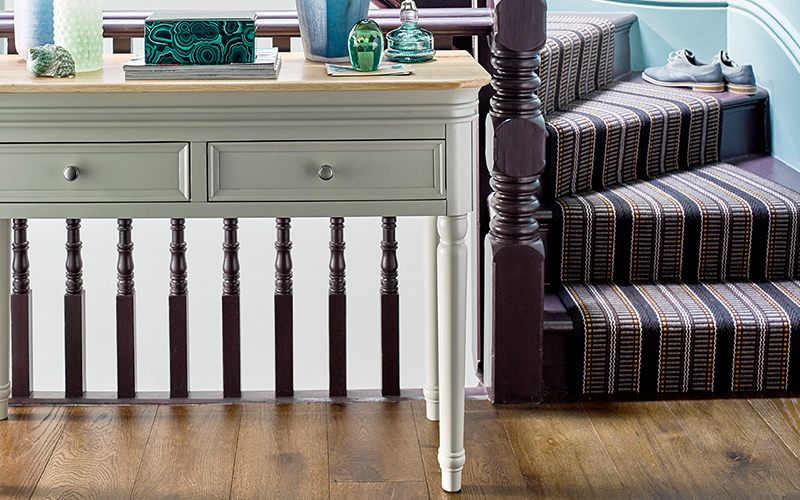 Painted console table in narrow hallway