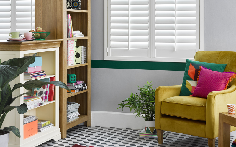 Oak and painted bookcases in bright living area