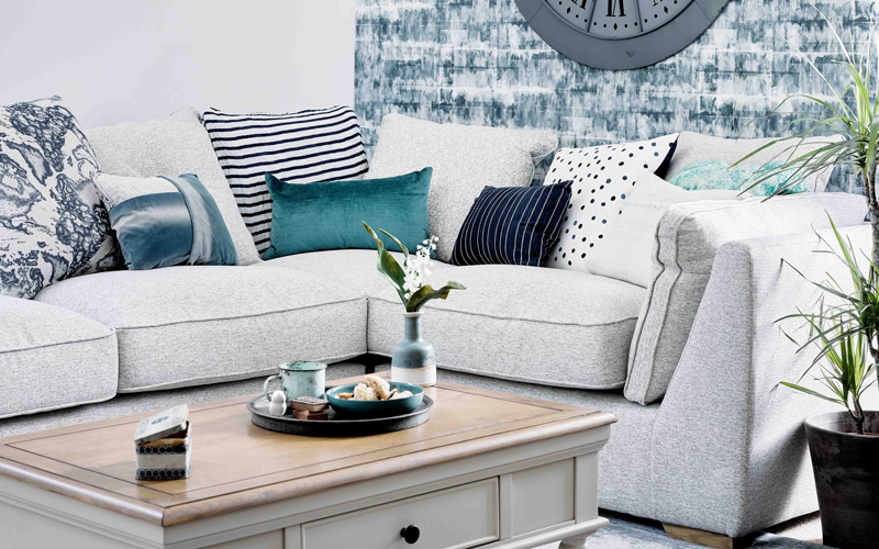 Grey corner sofa in coastal blue themed living room