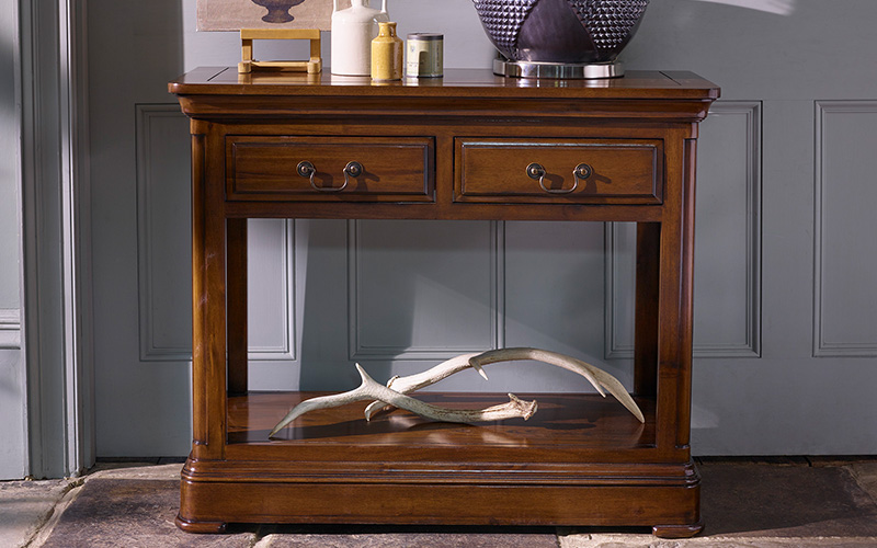 Dark natural oak console table against grey background