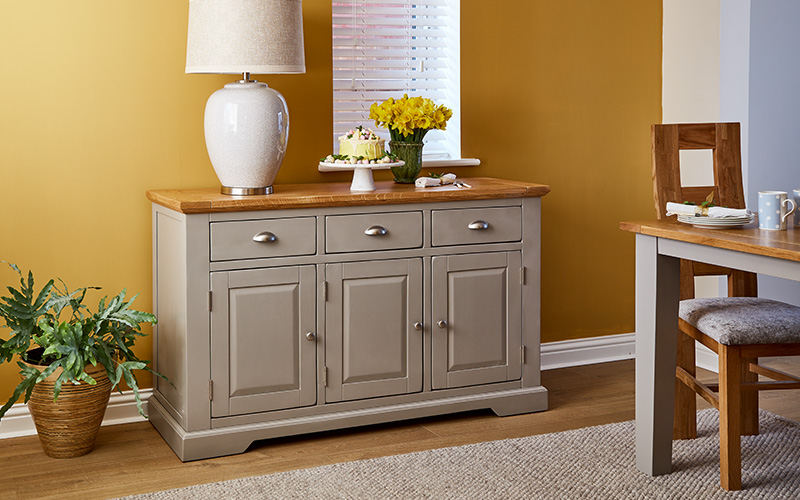 grey large sideboard against yellow background