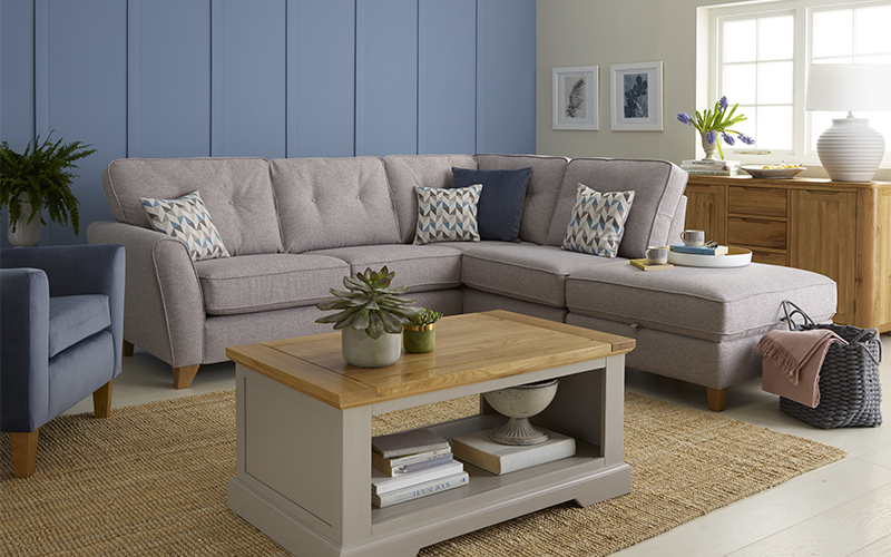 beige chaise corner sofa with grey painted coffee table in living room