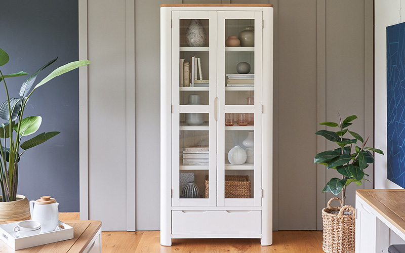 white display cabinet against grey background