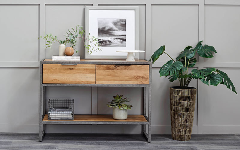 industrial style console table with photo frame and plants