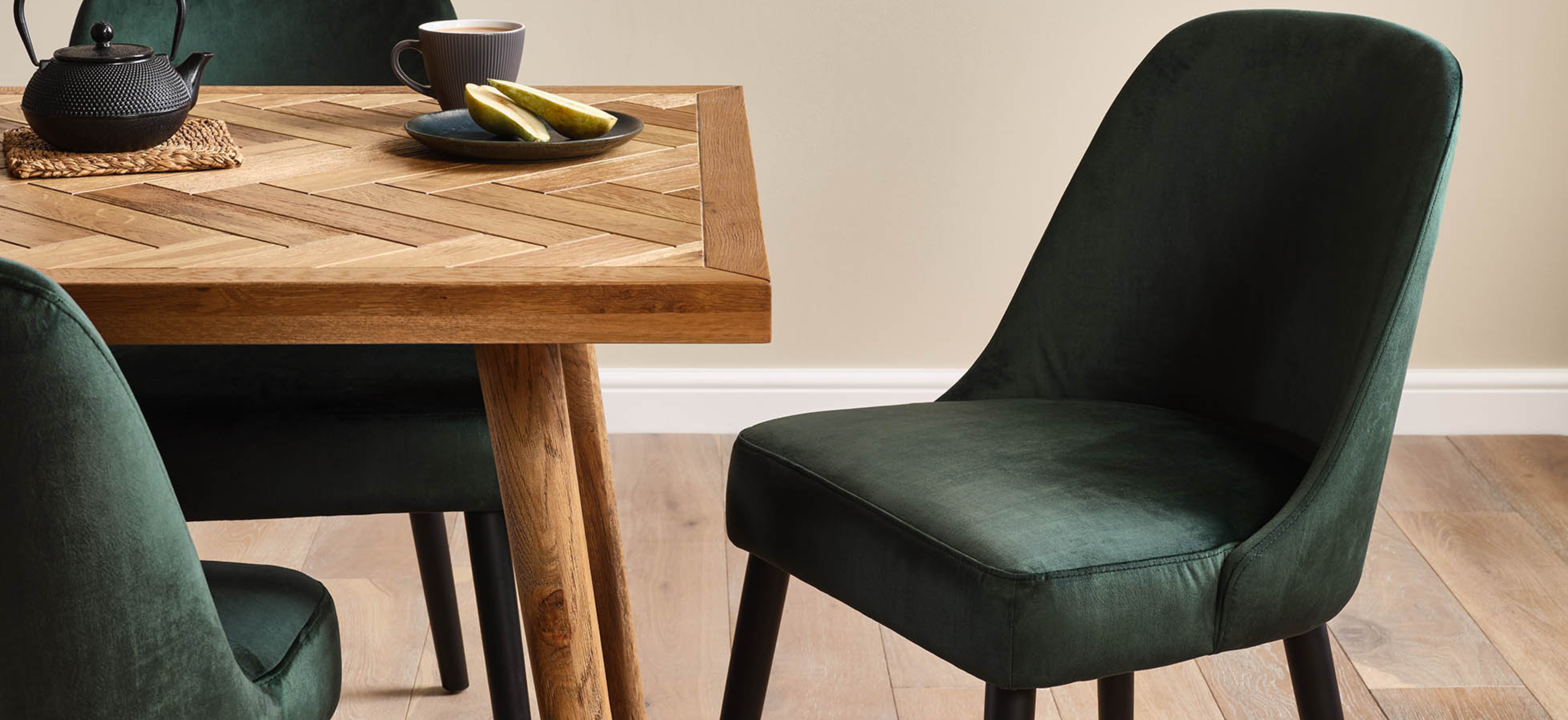 Oak furnitureland parquet table with bette green velvet chairs