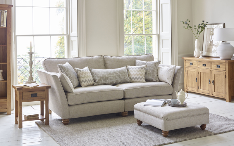 Traditional grey sofa with matching footstool