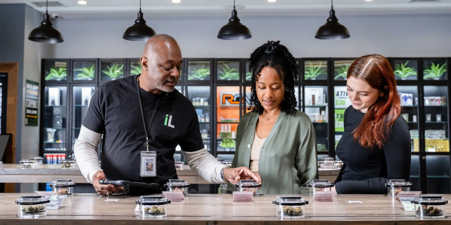 Budtender Guiding Customers at the ILYFTED Bud Bar